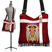 Red boho shoulder bag with Serbia emblem, white stripe, black fringe and crossbody strap