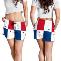 Women’s flag-print shorts on model, elastic waistband and black drawstring; red white blue stars