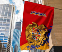 Armenia flag on pole, red with Armenia text and gold eagle shield emblem