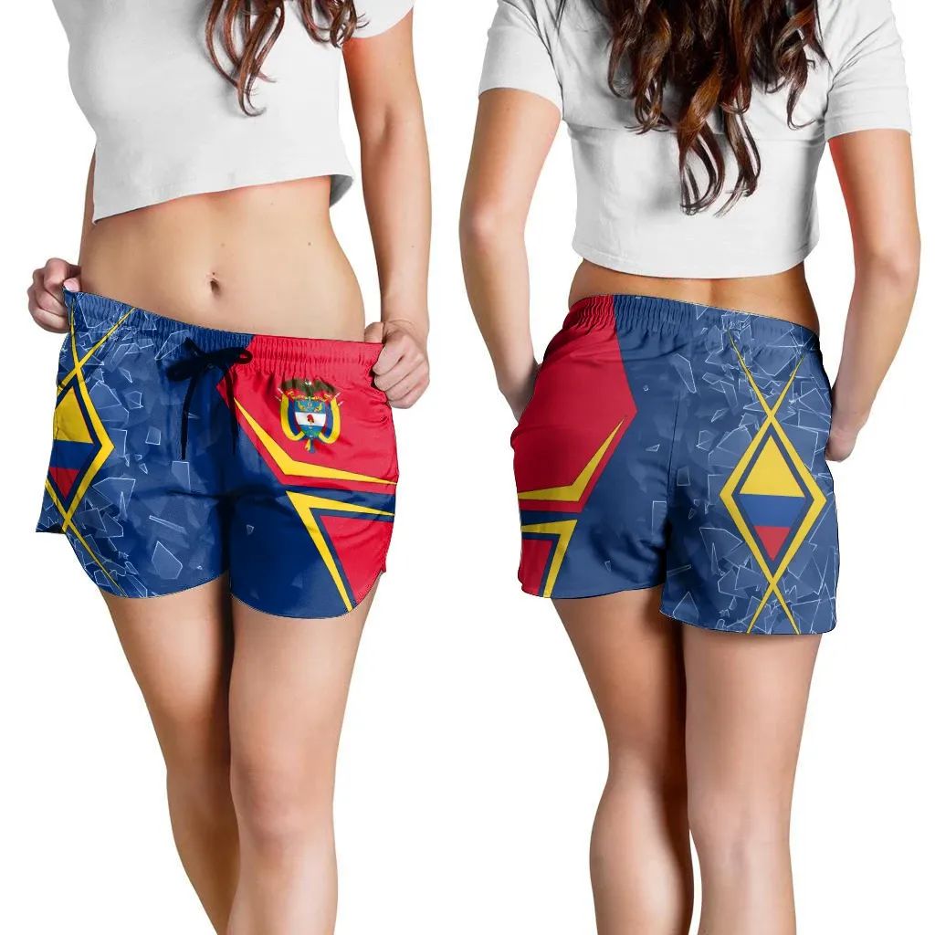 Colombia women’s shorts worn by model, blue with red side panel, drawstring ties
