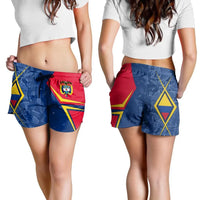 Colombia women’s shorts worn by model, blue with red side panel, drawstring ties