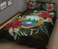 Black quilt bed set with Costa Rica emblem, red hibiscus flowers and tropical leaves