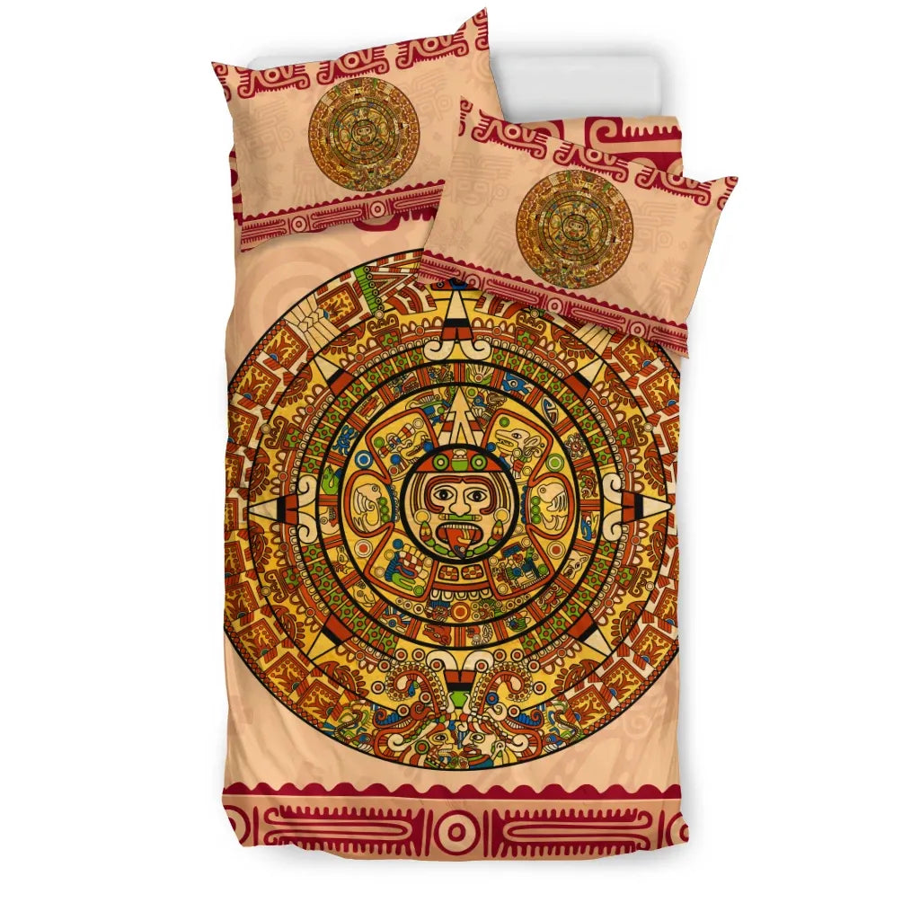 Aztec calendar bedding set with circular sun glyph on beige, red trim, two pillows