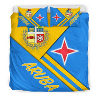 Aruba bedding set with yellow ARUBA script across blue duvet and crest detail on pillow