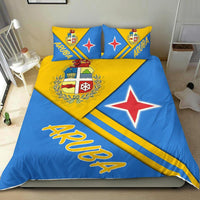 Aruba bedding set: blue duvet with yellow diagonal stripe, red star, and crest on pillows