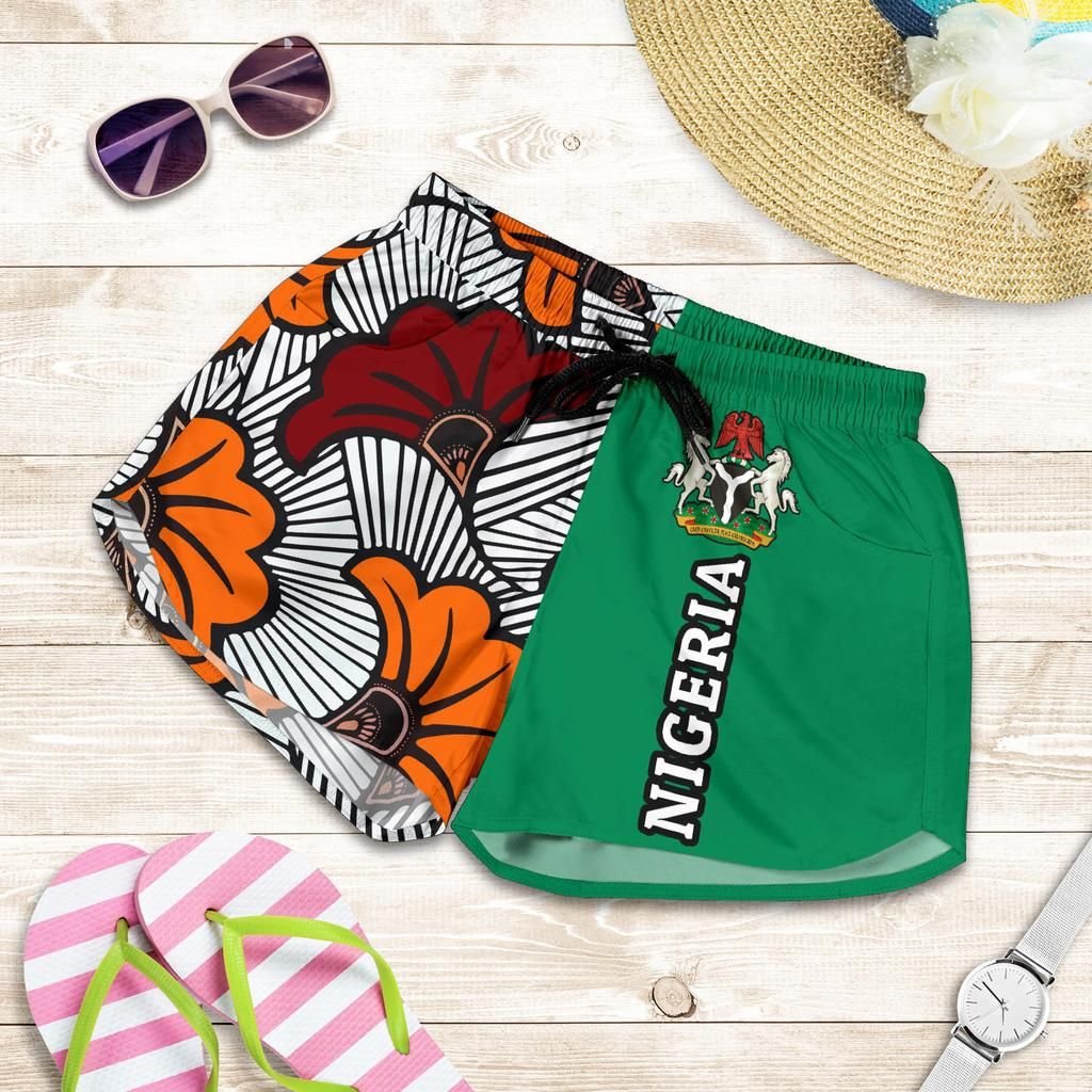 Green women’s shorts with drawstring elastic waist, “NIGERIA” print and crest logo