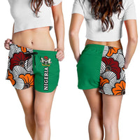 Women wearing Nigeria shorts: green front with “NIGERIA” print and patterned side panel
