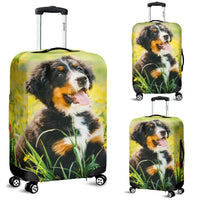 Black dog luggage cover with Bernese mountain dog in yellow flowers and green grass