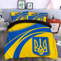 Blue and yellow duvet with large Ukrainian trident crest and matching striped pillowcases