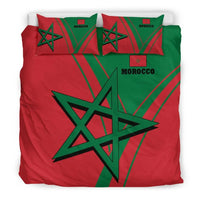 Morocco bedding set flat lay: red and green comforter with black star, two pillowcases