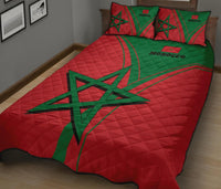 Red Moroccan quilt with bold green star design and two coordinating red-and-green pillows