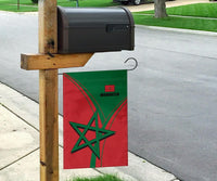 Morocco flag on post: red-green with star emblem and MOROCCO text