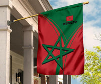 Morocco flag hanging on pole, red-green with star emblem and MOROCCO text