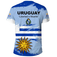 Light blue Uruguay T-shirt, back print with “URUGUAY,” sun emblem, crest, and flag stripes