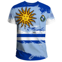 Light blue Uruguay T-shirt with sun emblem, crest, and blue-and-white flag stripes