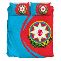 Full bedding set view with two matching pillows featuring coat of arms star design