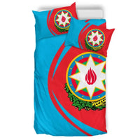 Duvet and pillows set with circular coat of arms emblem and flame in white star