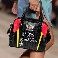 Black handbag with red sides, yellow stripes, crest front panel, top handles