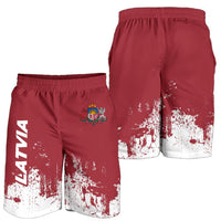 Latvia maroon shorts with crest and white splatter print; elastic waistband