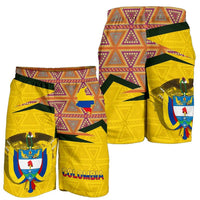 Yellow Columbia shorts, patterned back panel with crest, green side stripes