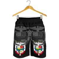 Black elastic-waist shorts with large crest graphic on each leg