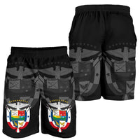 Two views of black elastic-waist shorts with star and crest graphic pattern
