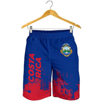 Herren-Shorts: blau mit rotem Spritzdruck, Costa-Rica-Wappen vorn, Gummibund