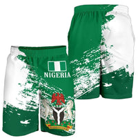 Side view Nigeria print shorts, green and white split design, elastic waistband