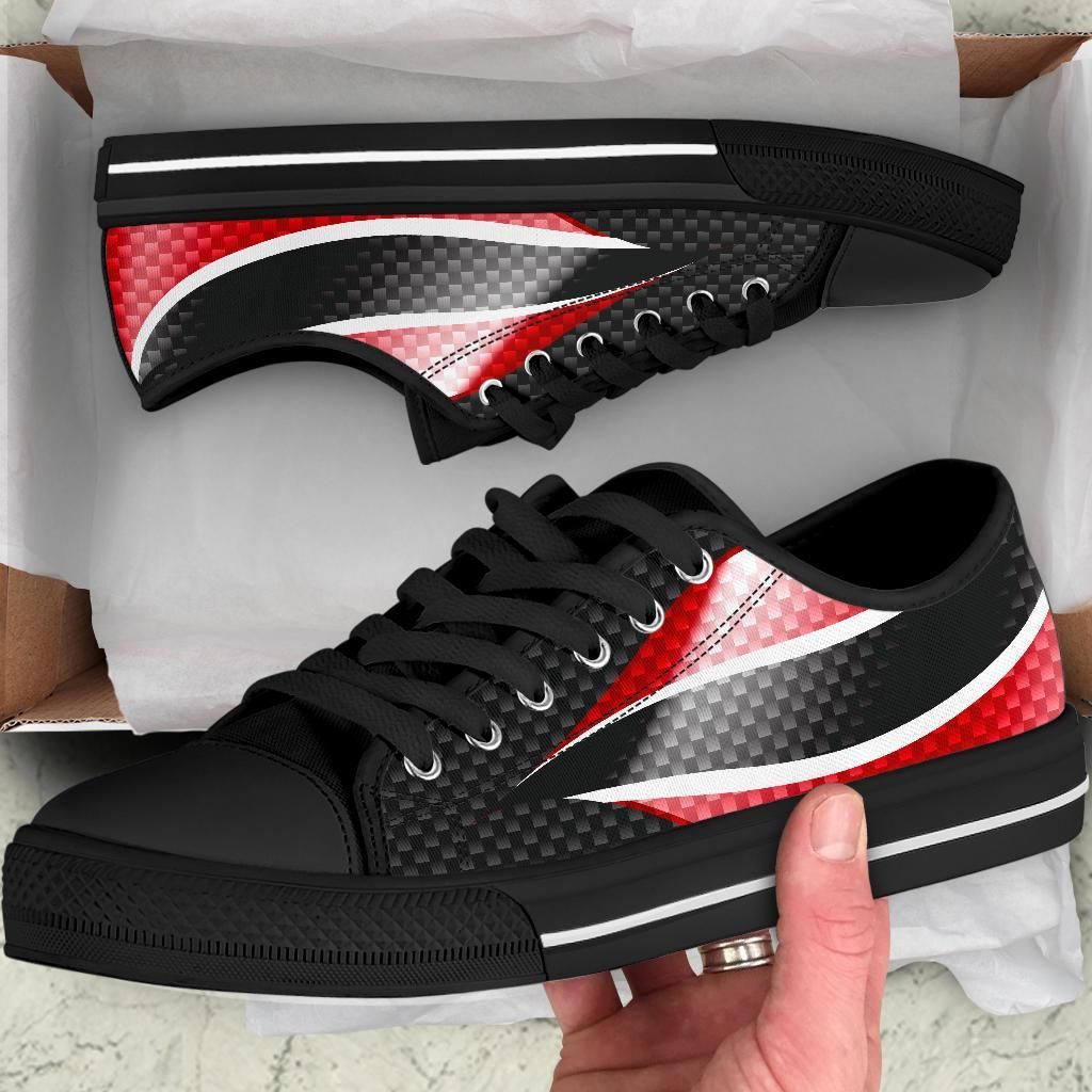 Black low top sneakers with Trinidad flag red/white accents and black laces