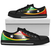 Black low-top sneakers on a box, flag pattern with white stars and striped sole