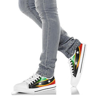 White low-top sneakers on legs, flag pattern with white stars and black lace trim