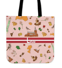 Pink tote bag with Latvia symbols, red stripe, 'Latvia' text, and black handles.