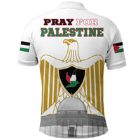 Back of white polo shirt shows large Pray for Palestine text over emblem graphic