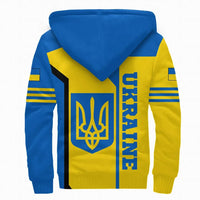 Colorful sherpa hoodie back panel with trident emblem, blue hood, blue/yellow blocks