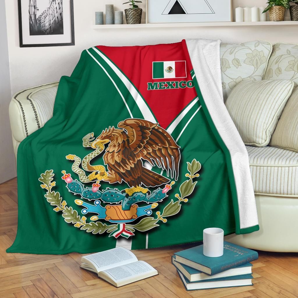 Mexican pride blanket with green panel and red crest, white border stripes and eagle emblem