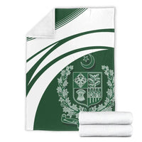 Folded Pakistan coat of arms blanket with two matching rolled white towels