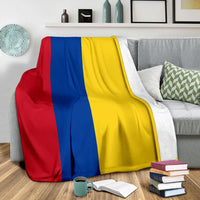 Draped blanket with red, blue and yellow stripes and white border
