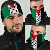 Keffiyeh bandana worn by man, black face covering with white soccer pattern and red/green stripes