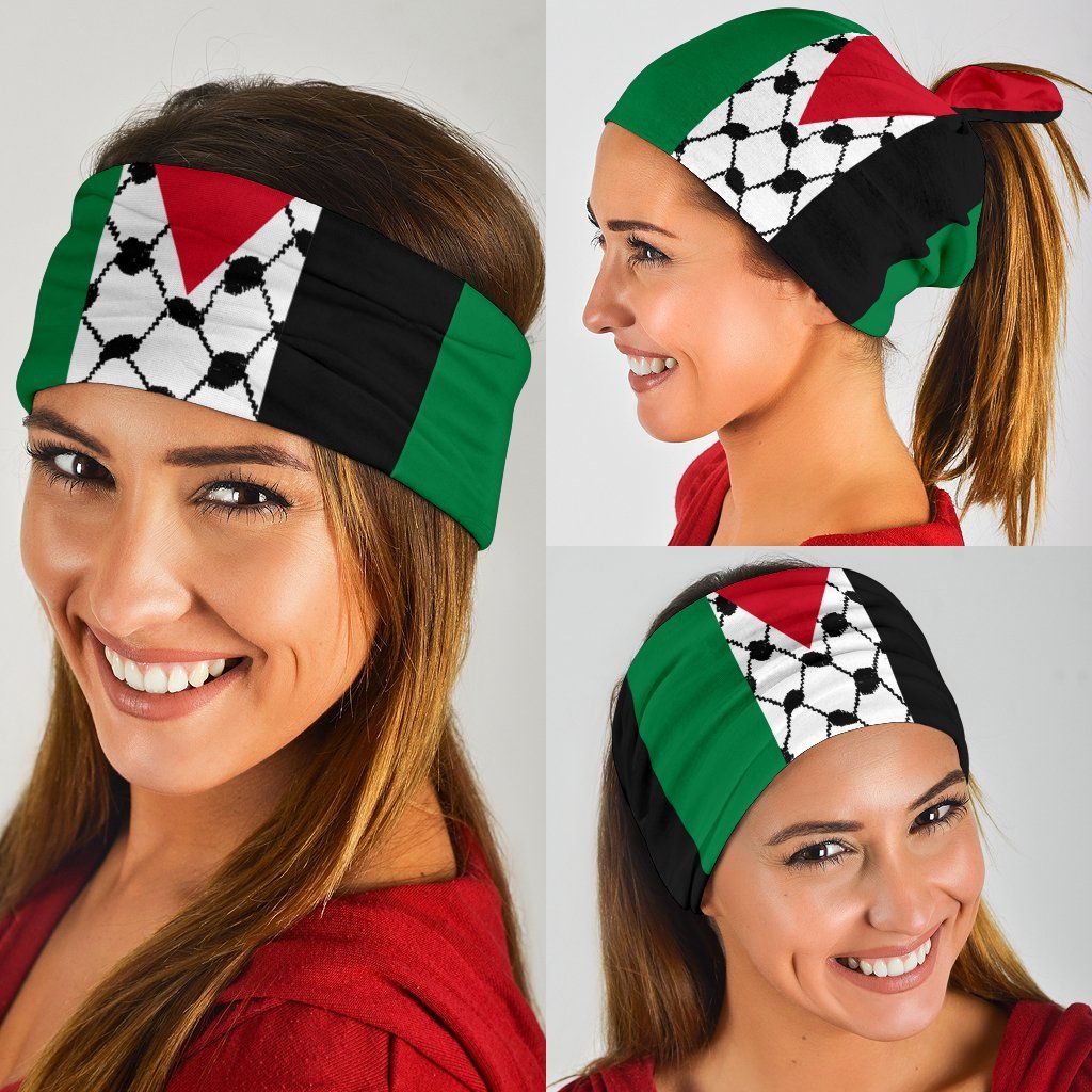 Keffiyeh bandana worn on head and covering face, black with white soccer design and red/green