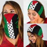 Palestine keffiyeh bandana worn by woman, black face mask with white soccer print and red/green