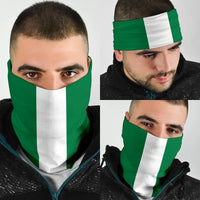Nigeria flag neck gaiter bandana with green and white vertical stripes, worn over face