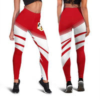 Red and white striped leggings with side chevrons and thigh crest patch