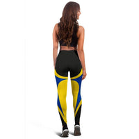 Back view leggings with black hex texture, yellow and blue panels, and curved waist design