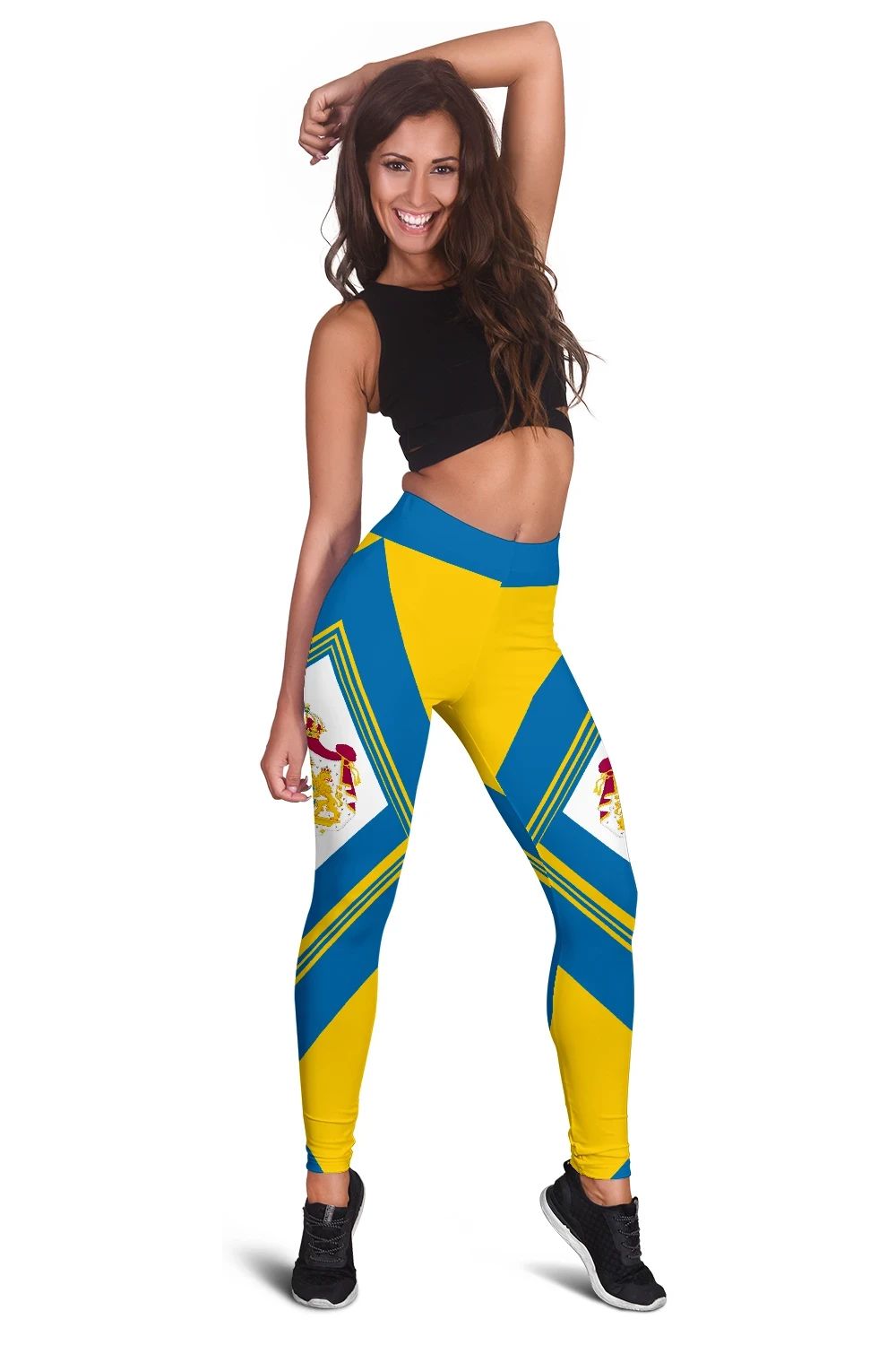 Colorful blue-and-yellow leggings with geometric chevrons and white crest panel on the thigh