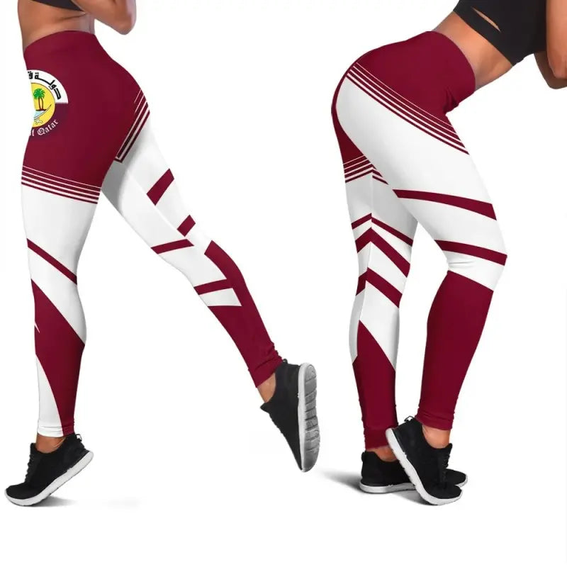 Close-up of maroon leggings with white diagonal stripes and small Qatar crest