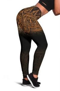 Side view black Aztec print leggings with gold-brown motifs and calendar figure detail.