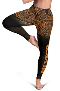 Close-up of black leggings showing gold-brown Aztec calendar face and circular motifs.