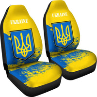 Two Ukraine car seat covers, yellow/blue print with UKRAINE text and trident emblem