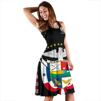 Side view of black sleeveless dress with Panama crest graphic and flared skirt