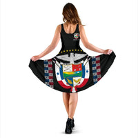 Back view: black sleeveless dress with Panama crest graphic, wide flared skirt